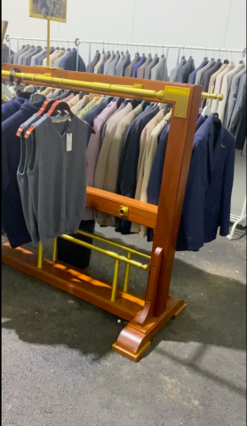 661477-138 Entire women's and men's clothing store, large batch of designer clothes and shop fittings.