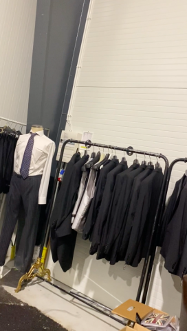 661477-140 Entire women's and men's clothing store, large batch of designer clothes and shop fittings.