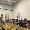 661477-141 Entire women's and men's clothing store, large batch of designer clothes and shop fittings.