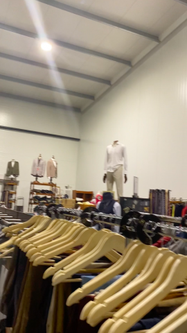 661477-141 Entire women's and men's clothing store, large batch of designer clothes and shop fittings.