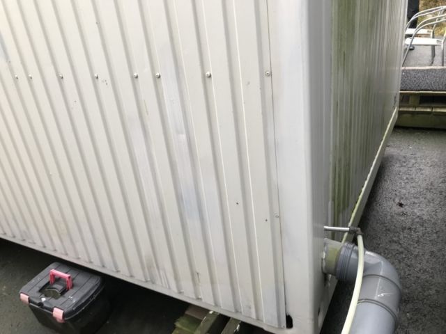 758861-10 Staff shed with sheet metal facade