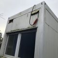 758861-12 Staff shed with sheet metal facade