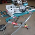 771256-3 Cutting & Miter saw Makita LS1016L with folding table.