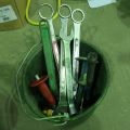 832819-3 Perforated bucket with various hand tools