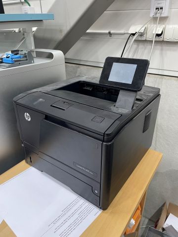 848061-7 Two printers, HP Laserjet P3015 and Pro 400