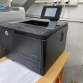 848061-8 Two printers, HP Laserjet P3015 and Pro 400