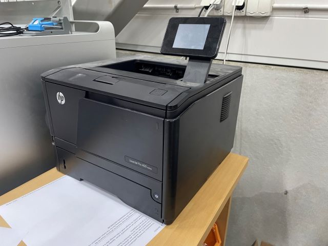 848061-8 Two printers, HP Laserjet P3015 and Pro 400