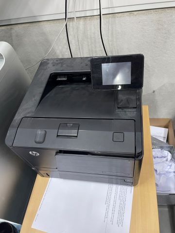 848061-10 Two printers, HP Laserjet P3015 and Pro 400