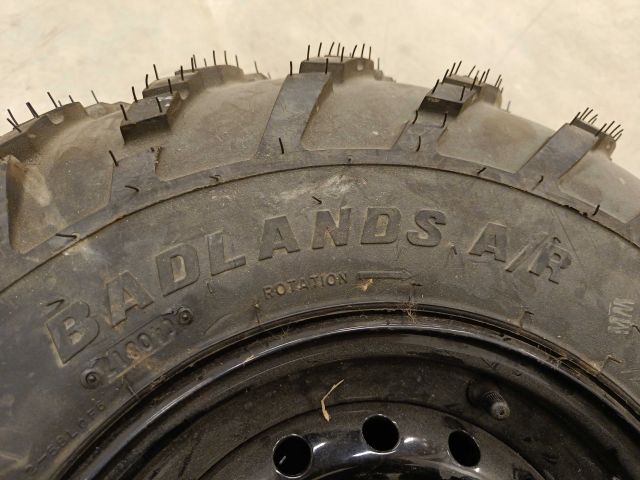 754197-6 3 ATV tires, of which 2 on rim, Carlisle Badlands A / R 26x8,00R12 NHS