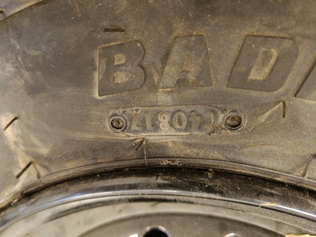 754197-7 3 ATV tires, of which 2 on rim, Carlisle Badlands A / R 26x8,00R12 NHS