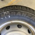 824564-2 6 studded C-tires on rim, Nissan Cabstar