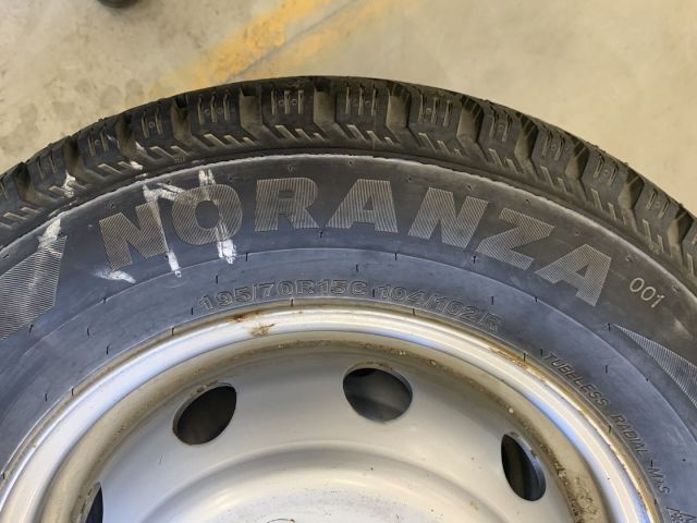 824564-2 6 studded C-tires on rim, Nissan Cabstar