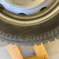 824564-3 6 studded C-tires on rim, Nissan Cabstar