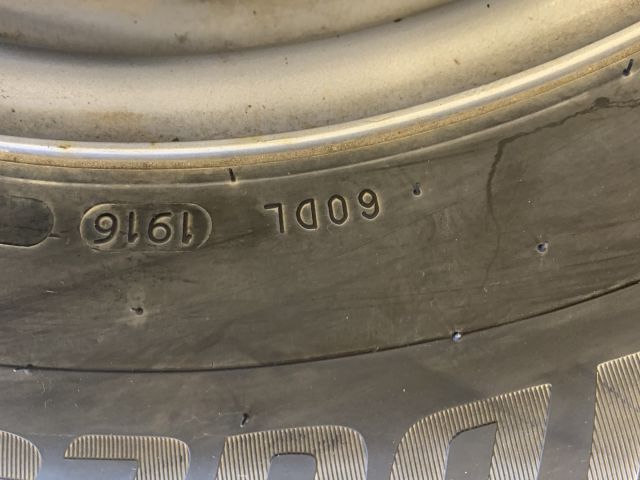 824564-4 6 studded C-tires on rim, Nissan Cabstar