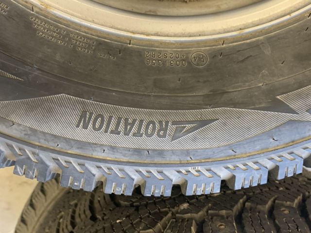 824564-5 6 studded C-tires on rim, Nissan Cabstar