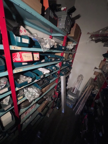 921201-8 Shelves with spare parts for older Citroën 60s-90s, as well as spare parts, oils, exhaust pipes