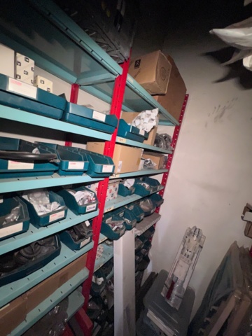 921201-9 Shelves with spare parts for older Citroën 60s-90s, as well as spare parts, oils, exhaust pipes