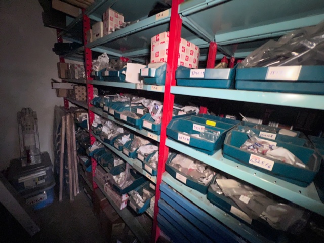 921201-14 Shelves with spare parts for older Citroën 60s-90s, as well as spare parts, oils, exhaust pipes