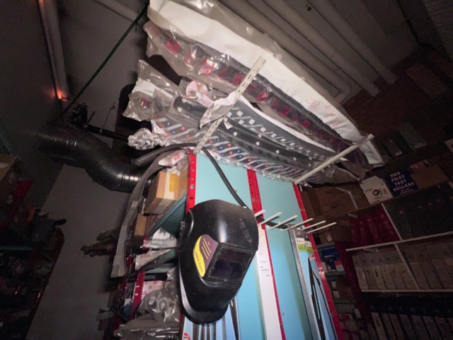 921201-16 Shelves with spare parts for older Citroën 60s-90s, as well as spare parts, oils, exhaust pipes