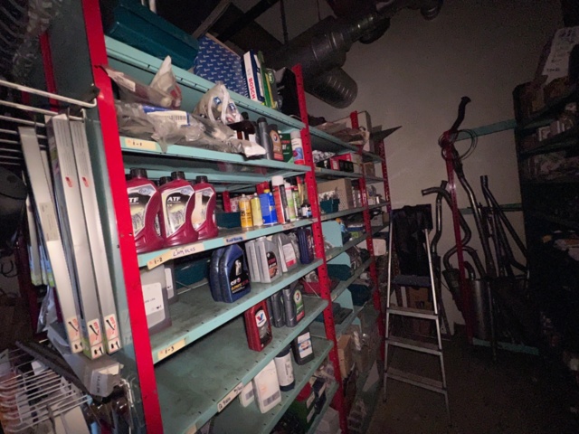 921201-22 Shelves with spare parts for older Citroën 60s-90s, as well as spare parts, oils, exhaust pipes