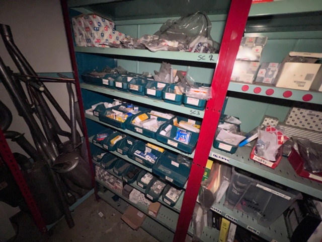 921201-27 Shelves with spare parts for older Citroën 60s-90s, as well as spare parts, oils, exhaust pipes