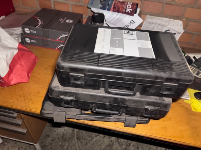 921201-34 Shelves with spare parts for older Citroën 60s-90s, as well as spare parts, oils, exhaust pipes