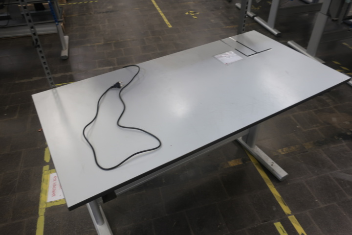 933996-2 Raised and lowerable desk and extra mounted shelf