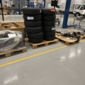 921812-2 4 pallets with tires, rims and axles