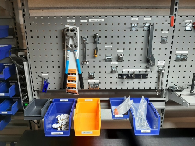 920875-21 Raised/retractable workbench with tool boards, lighting and contents x2