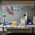 920875-22 Raised/retractable workbench with tool boards, lighting and contents x2