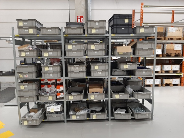 920897-3 9 shelf sections with a large assortment of new spare parts and various components