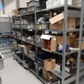 920897-4 9 shelf sections with a large assortment of new spare parts and various components