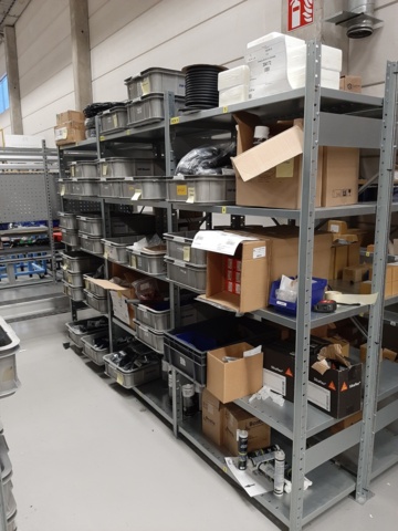 920897-4 9 shelf sections with a large assortment of new spare parts and various components