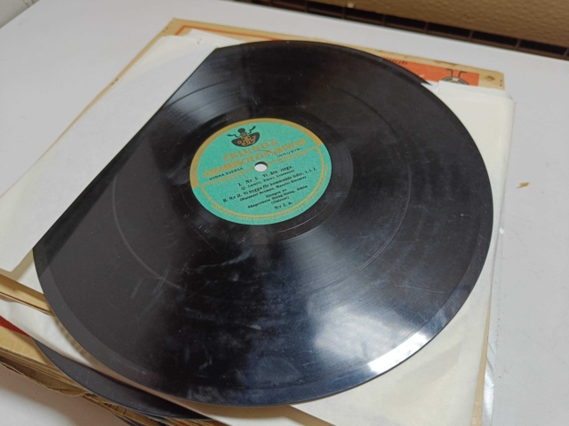 887947-27 Large stone cake / gramophone record collection