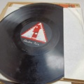 887947-29 Large stone cake / gramophone record collection
