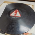 887947-30 Large stone cake / gramophone record collection