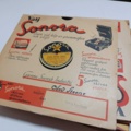 887947-39 Large stone cake / gramophone record collection
