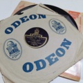 887947-54 Large stone cake / gramophone record collection
