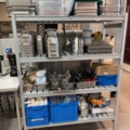 921075-1 Modular shelf with a large collection of restaurant accessories (canteens, tins, scales, etc.).