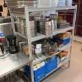 921075-2 Modular shelf with a large collection of restaurant accessories (canteens, tins, scales, etc.).