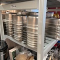 921075-5 Modular shelf with a large collection of restaurant accessories (canteens, tins, scales, etc.).