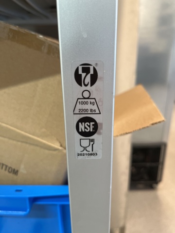 921075-19 Modular shelf with a large collection of restaurant accessories (canteens, tins, scales, etc.).