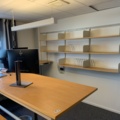 992594-1 Office furniture: Electric raise/lower desk, 4 HP 24" computer monitors, wall shelves, etc.