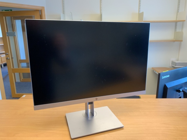 992594-4 Office furniture: Electric raise/lower desk, 4 HP 24" computer monitors, wall shelves, etc.