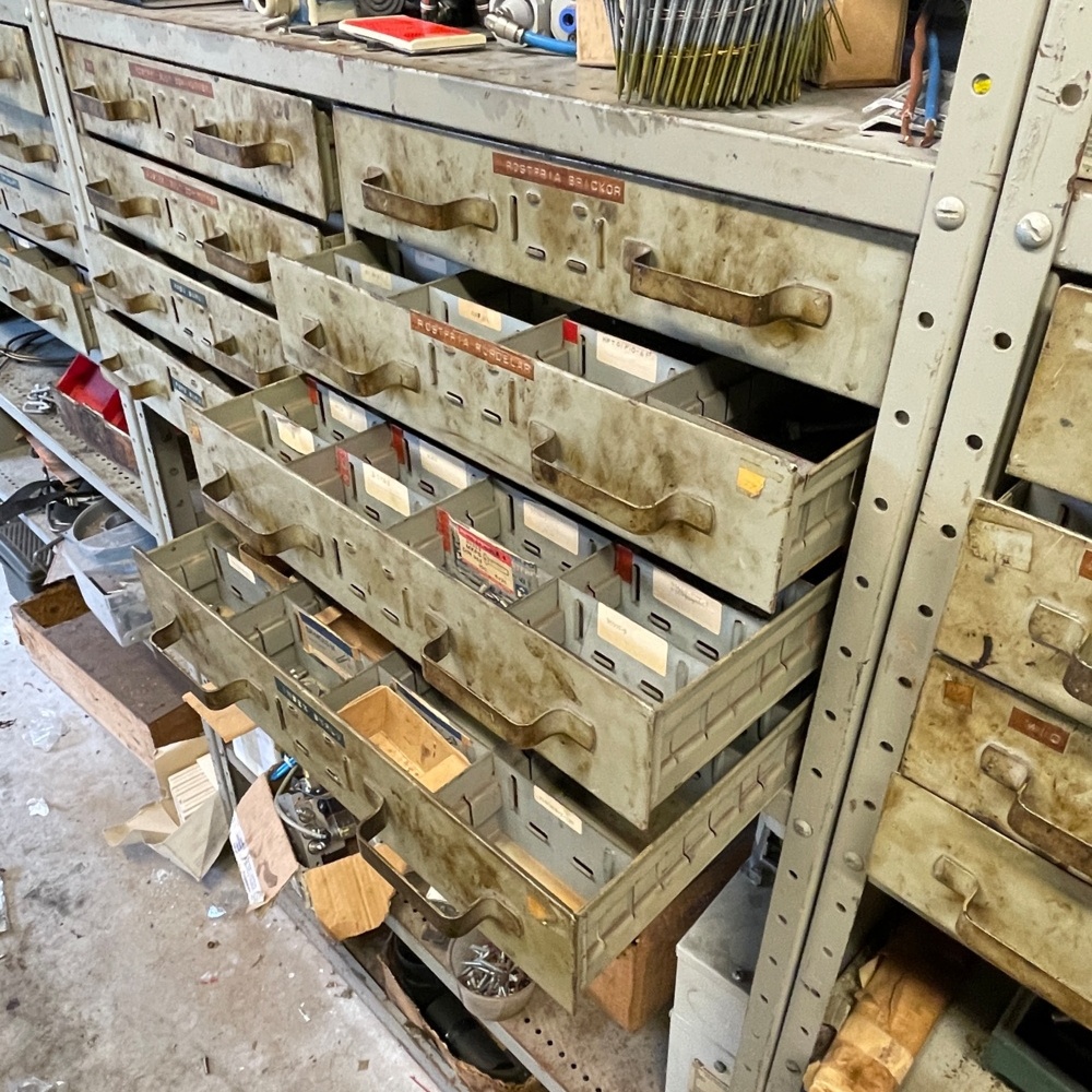1059771-2 3 metal shelves with things on them