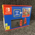 1058576-3 Nintendo Switch (Red Joy-Con pair) incl Super Mario Odyssey