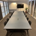 1078422-1 Large conference table & 14 chairs as well as stand for screen