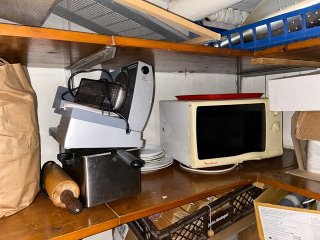 1144223-12 Storage room with various restaurant equipment