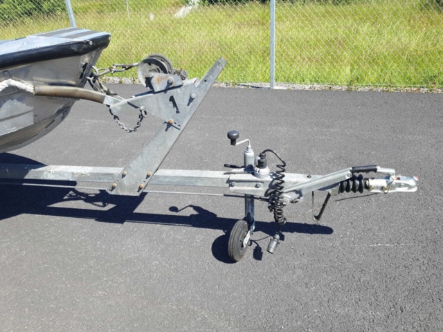 1035933-34 Buster aluminum boat on trailer and 4-stroke engine