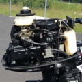 1035933-33 Buster aluminum boat on trailer and 4-stroke engine